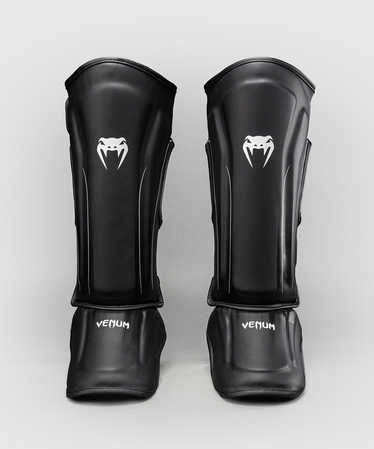 Venum Stealth Espinilleras – Negro/Blanco