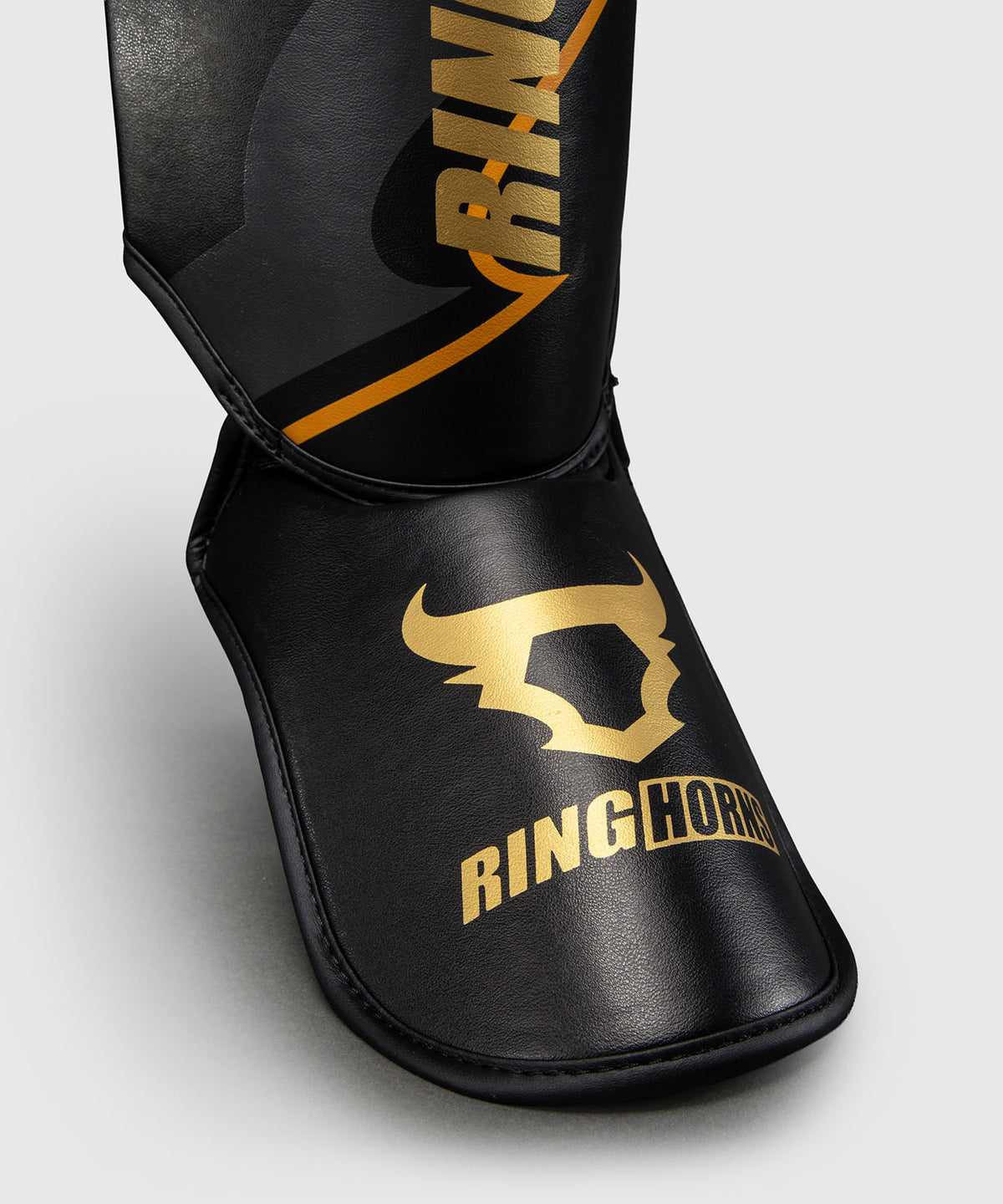Ringhorns Charger by Venum Shin Guards - Black/Gold