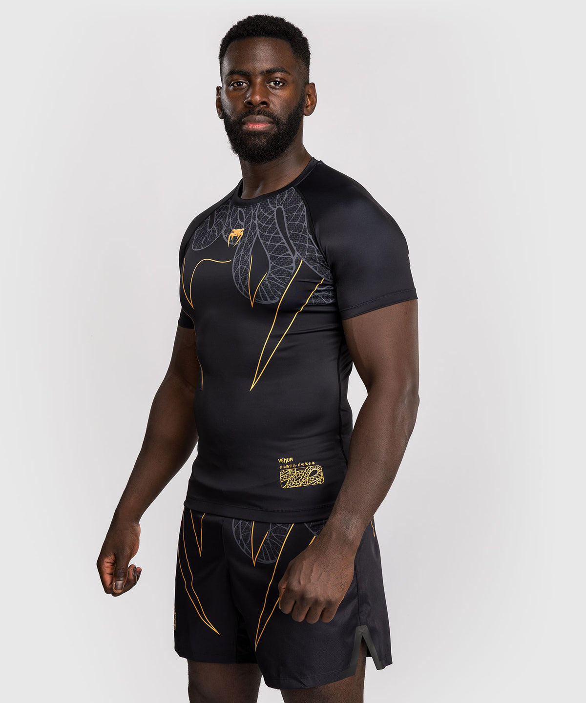 Venum Serpenti Kurzarm Rashguard – Schwarz/Silber/Gold