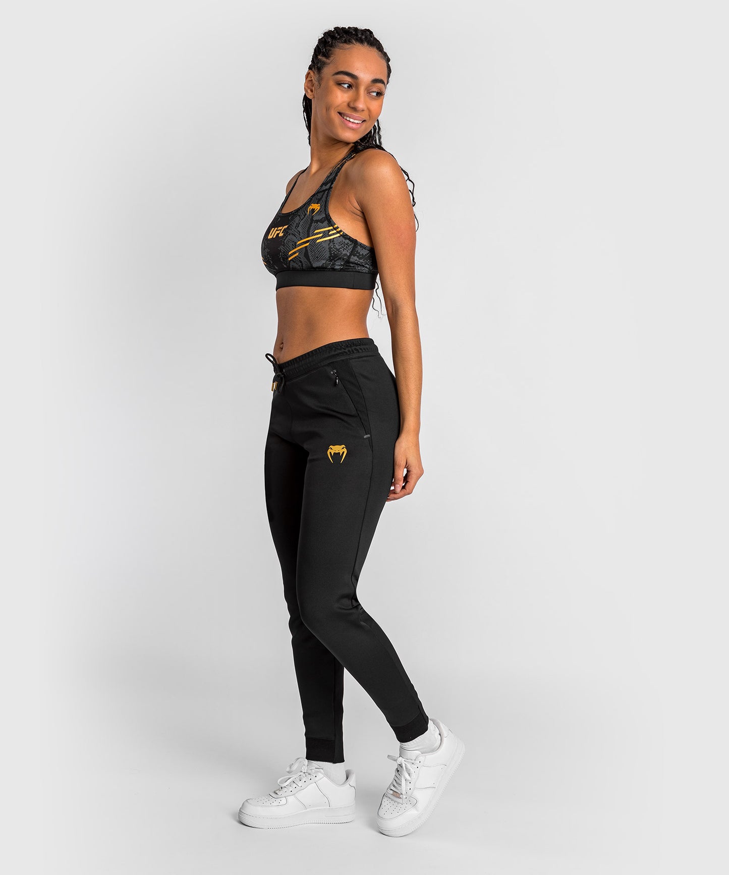 UFC Adrenaline by Venum Authentic Fight Night Walkout-Hose für Frauen Women’s Walkout Pant  - Champion
